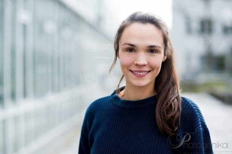 Authentic portrait of a young woman during a photo shoot in a Munich photo studio, professionally photographed for personal or business pictures.